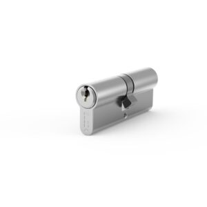Metal cylinder lock with a key inserted on the left, shown at a slight angled perspective