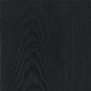 Close-up of a dark wood grain panel with visible swirls and linear patterns.