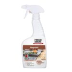 White spray bottle labeled 'Pomoc Domowa Professional' with 'Nagrobki' on the label and a photo of stone surfaces on the front image.