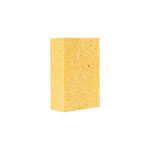 Yellow kitchen sponge with a porous surface standing upright on a white background