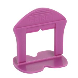 Pink plastic craft hole punch with a rectangular punching window, used for scrapbooking or paper crafts.