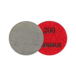 Two round abrasive pads: a gray textured polishing pad and a red 200-grit pad, used for sanding and polishing surfaces.