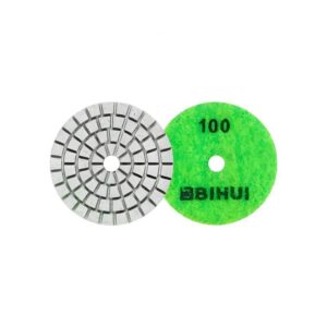 Two circular grinding discs: a gray segmented abrasive wheel and a bright green 100-grit polishing pad.