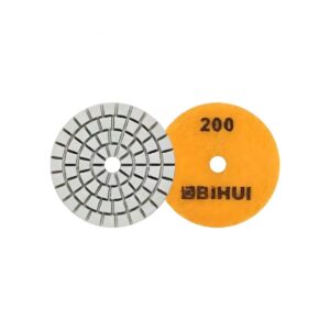Two circular abrasive tools: a segmented metal grinding wheel and a yellow 200-grit polishing disc.
