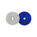 Two circular grinding discs: a segmented metal abrasive wheel and a solid blue wheel with a central hole.