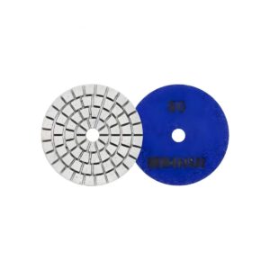 Two circular grinding discs: a segmented metal abrasive wheel and a solid blue wheel with a central hole.