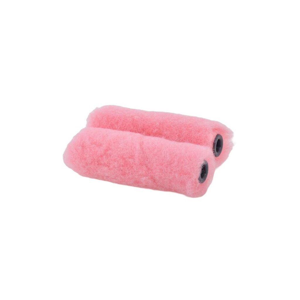 Two pink foam paint roller covers with black inner cores lying side by side on a white background.