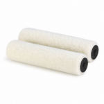 Two fluffy white paint roller covers lying side by side on a white background.
