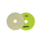 Two round sanding discs: one green 100-grit disc with a central hole and brand text, and a matching metallic disc with a hexagonal honeycomb abrasive surface.