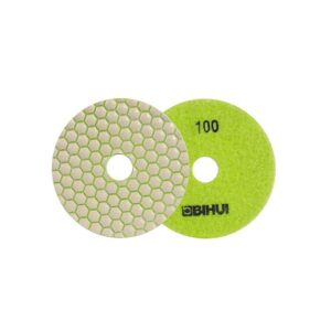Two round sanding discs: one green 100-grit disc with a central hole and brand text, and a matching metallic disc with a hexagonal honeycomb abrasive surface.