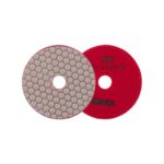 Two overlapping circular discs for grinding and polishing: a red abrasive wheel with a center hole and a gray hex-pattern polishing disc