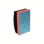 Blue patterned notebook with an orange-pink spine and black back cover, angled upright on a white background to show its design.