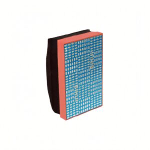Blue patterned notebook with an orange-pink spine and black back cover, angled upright on a white background to show its design.