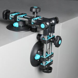 Modular blue-and-black adjustable clamping jig attached to a cabinet edge for panel alignment and securing parts