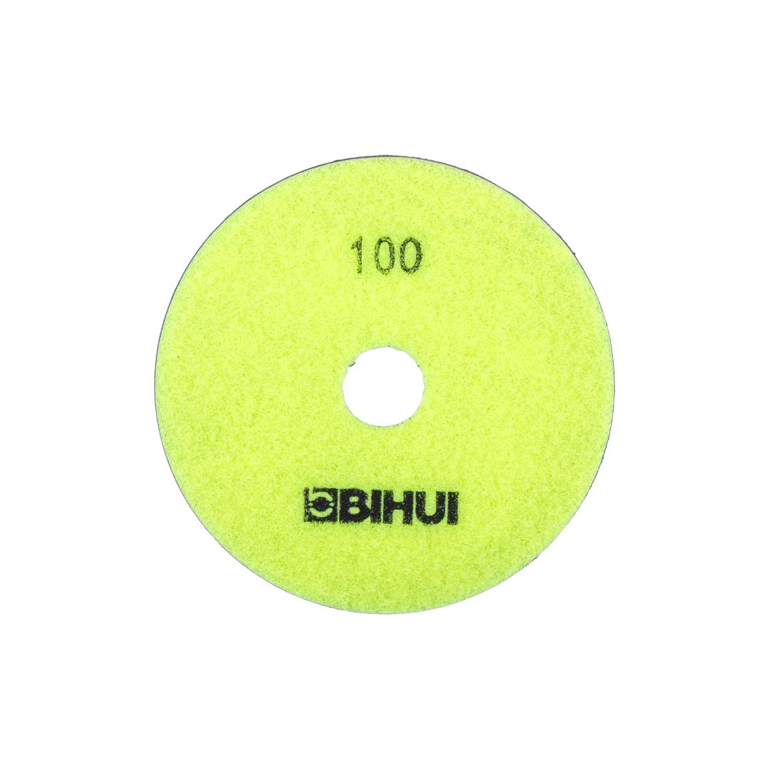 megabudowlany-bihui-krazek-diamentowy-polerowanie-na-sucho-p100-sklep-budowlany - Mega Budowlany Bright yellow 100-grit sanding disc with a central hole and BiHUI branding (for grinders)