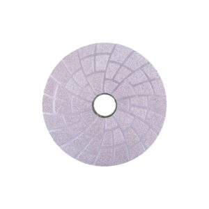 Purple circular sanding disc with a central hole and segmented surface for grinding or polishing