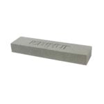 Grey rectangular abrasive sharpening/sanding stone with a rough textured surface and engraved markings on top, shown at an angle