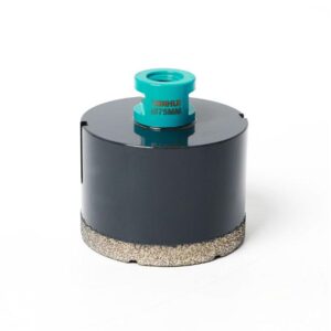 Turquoise arbor on top of a dark cylindrical core drill bit, Ø75mm, with a textured bottom edge indicating diamond segments on a white background under bright light.