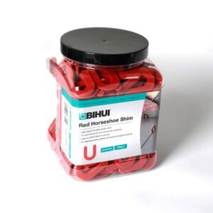 Jar of red horseshoe shims labeled BIHUI Red Horseshoe Shim, sealed container for precision shims used in machining.