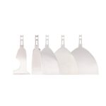 Set of five stainless steel icing spatulas of different blade sizes arranged in a row.