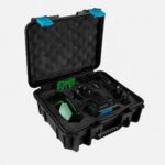 Open black protective case with foam padding and assorted precision instruments inside